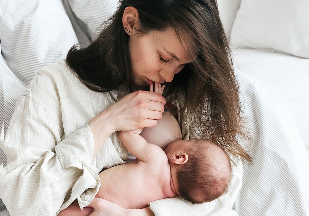 A mother breastfeeding her baby